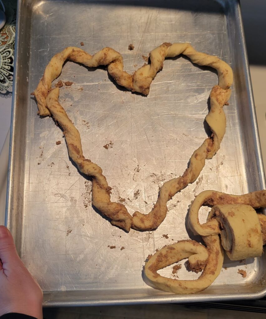 cinnamon roll dough in shpae of a heart