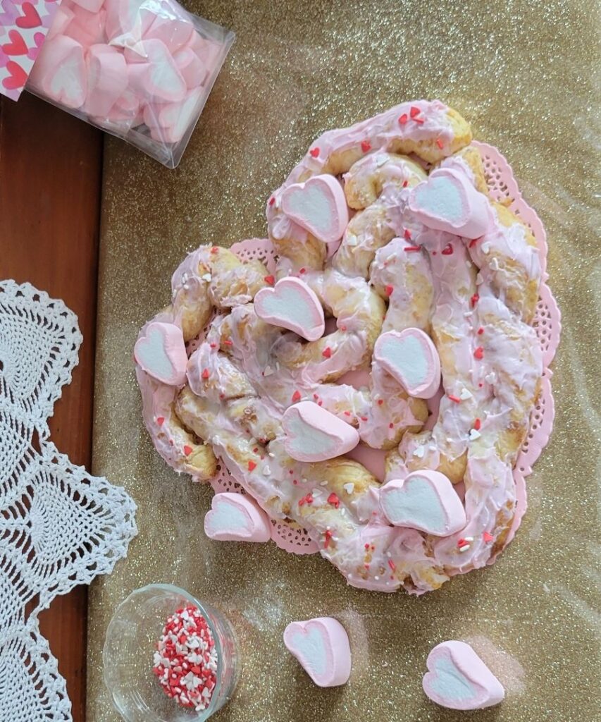 heart shaped cinnamon rolls with pink marshmallow hearts