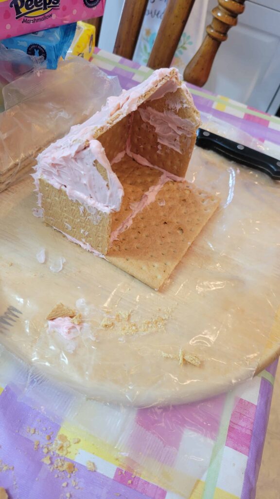 graham cracker house walls with frosting