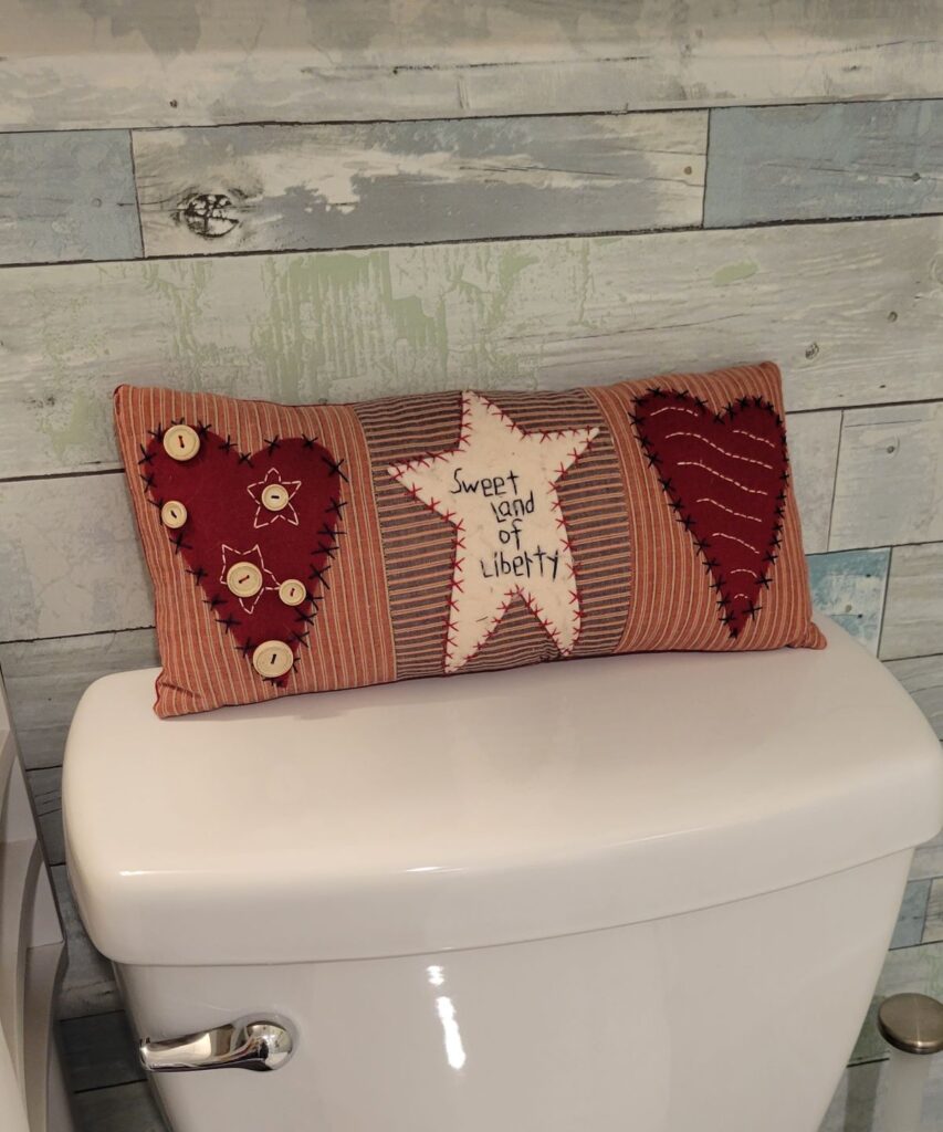 Pillow with red hearts, white star