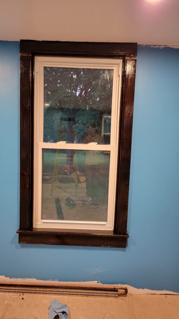 poly stained window frame in dark brown