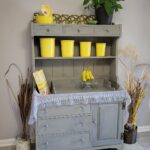 gray hutch with yellow tupperware