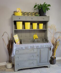 gray hutch with yellow tupperware