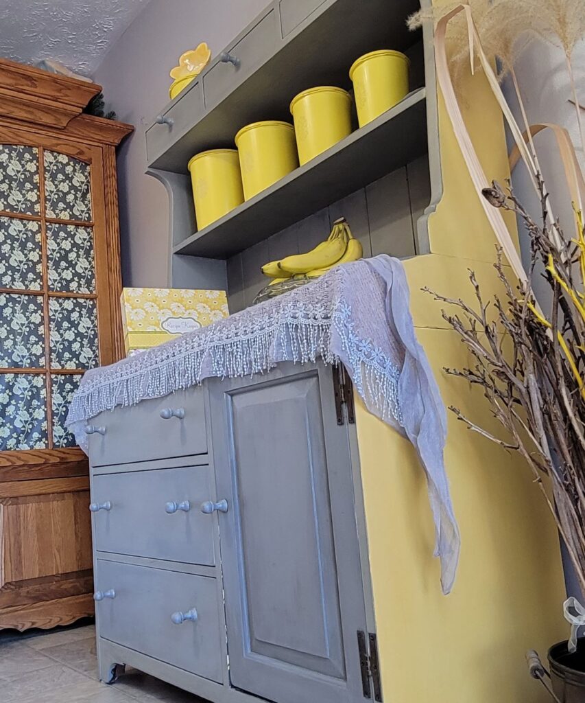 yellow and gray painted hutch