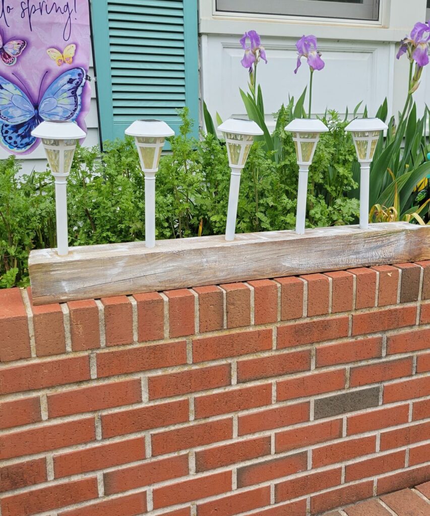 white solar lights in horizontal fence post