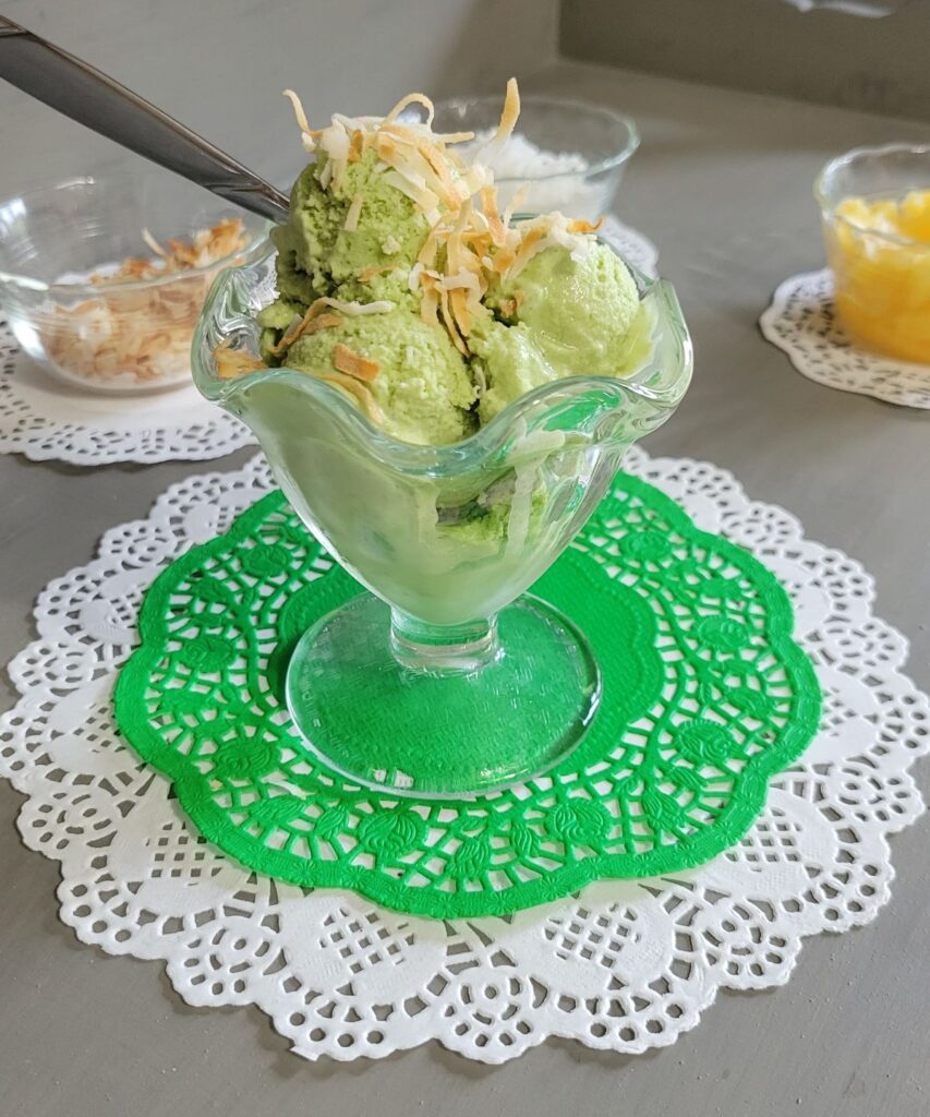 green ice cream with toasted coconut on top