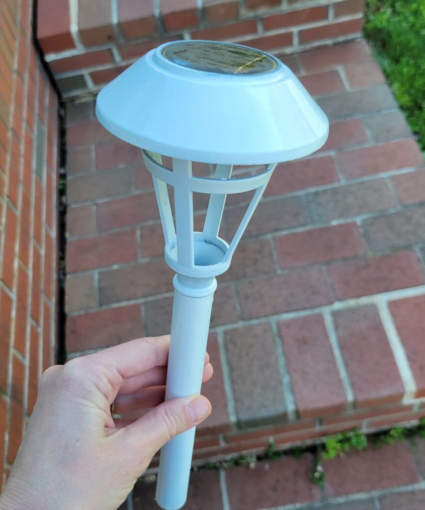 white spray painted solar light