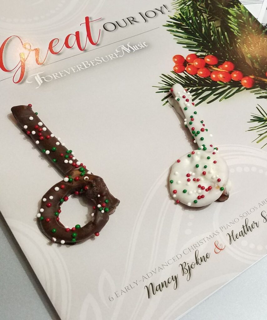 music note shaped pretzels on Christmas book