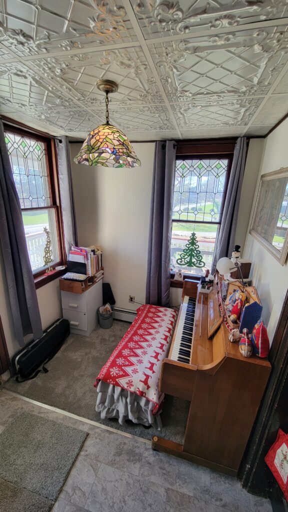 piano room decorated for Christmas