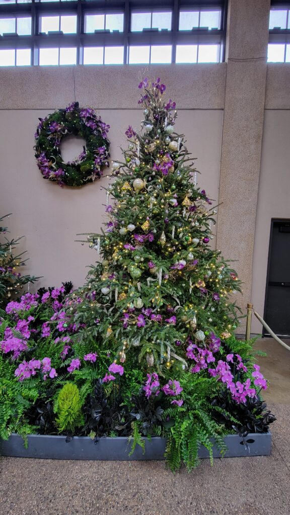 purple themed Christmas tree with orchids