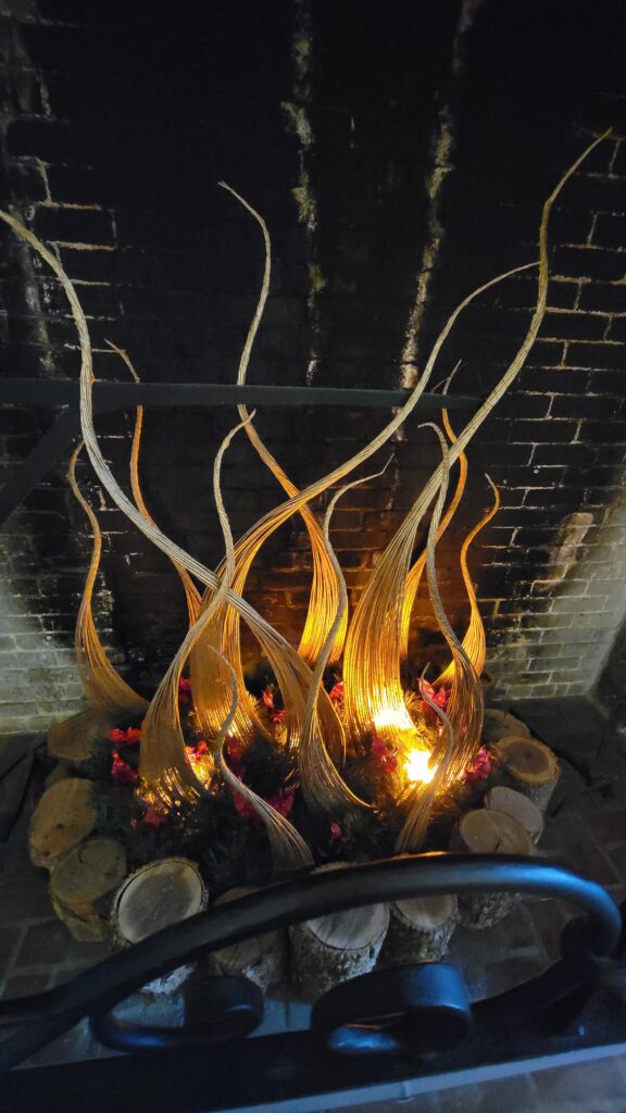 grasses weaved into a fire look