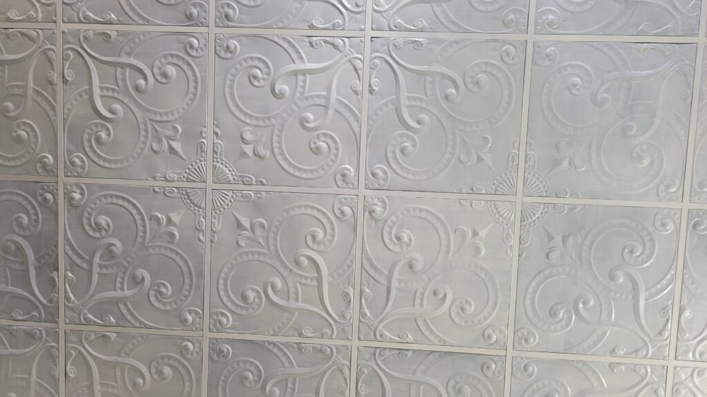 embossed fleur de lys in ivory