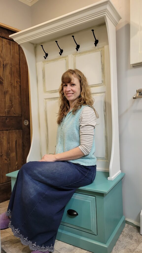 person sitting on hall bench