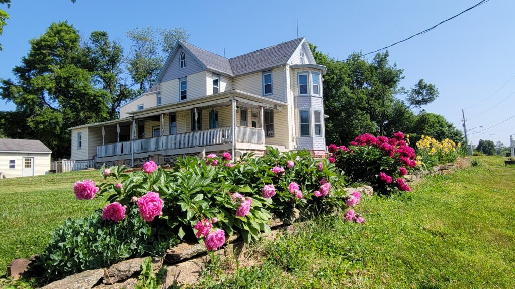 beautiful flower garden and old farmhouse