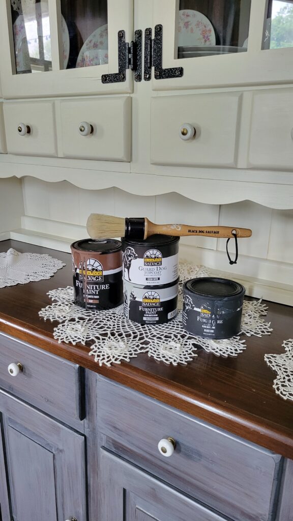 black dog salvage paint cans on hutch