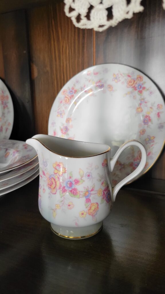 pink and yellow flowered creamer