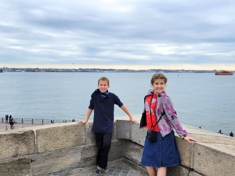 cute kids at the Statue of Liberty
