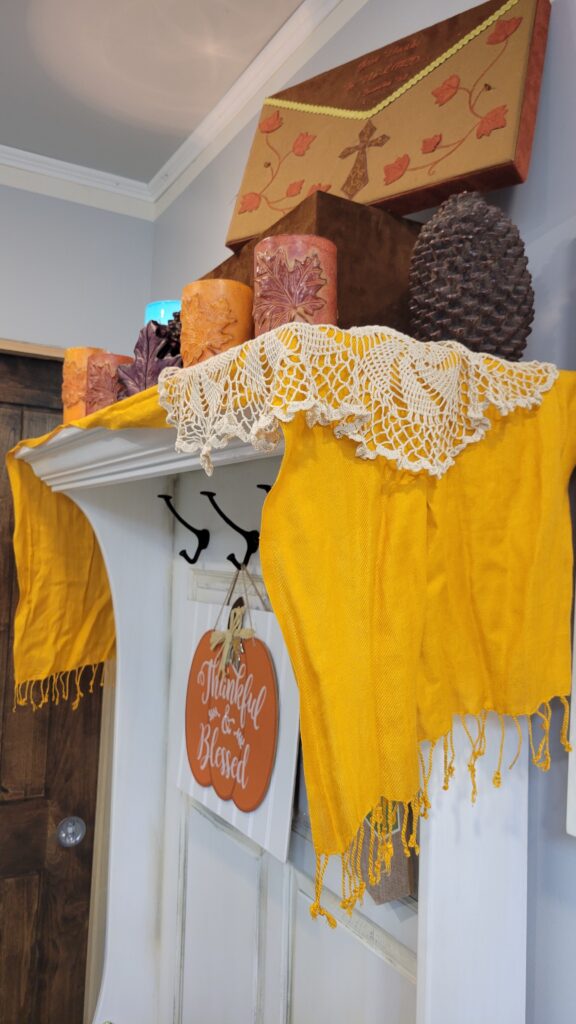 doily and yellow scarf