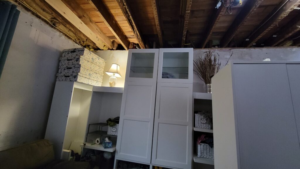 entertainment center used as mud room cabinets