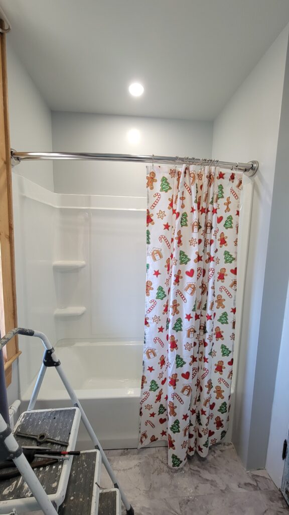 shower with Christmas shower curtain