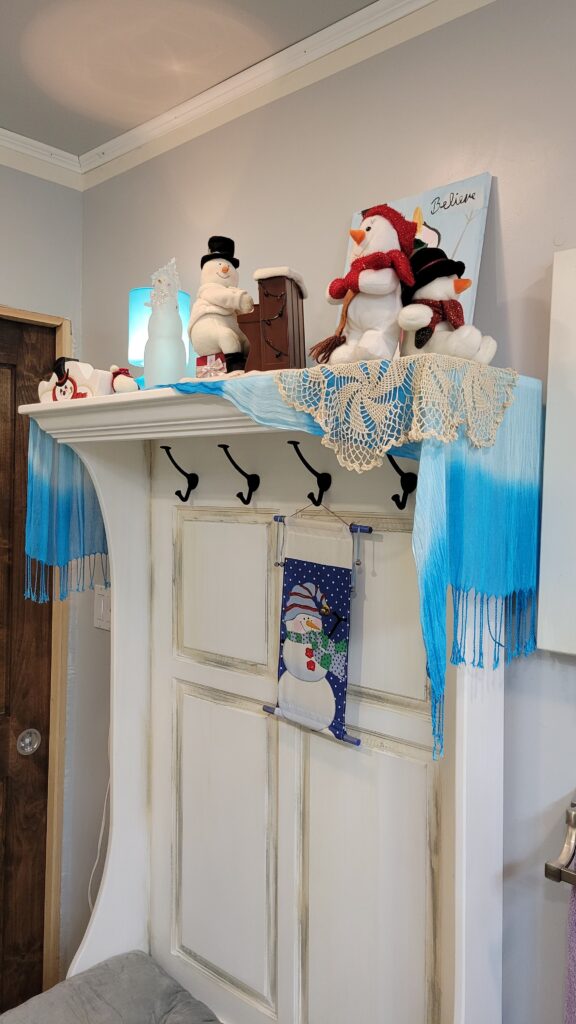 snowman decor on a hall bench