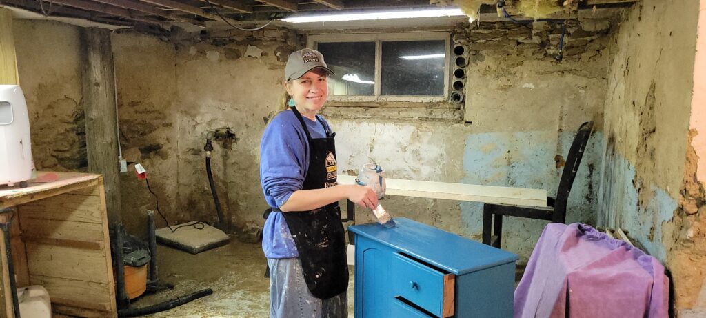 woman with blue painted cabinet