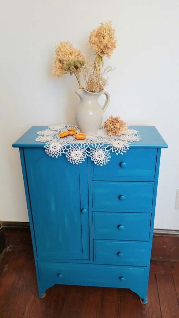 doily and vase on cabinet