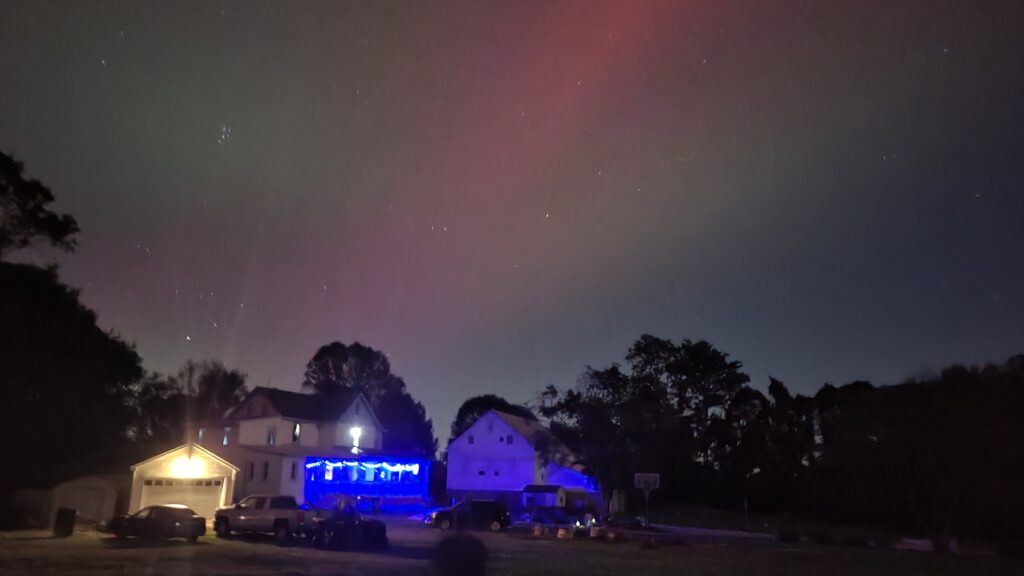 Century Farms house with northern lights