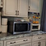 kitchen counter with microwave and under cabinet CD radio player