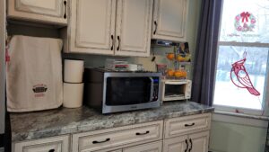 kitchen counter with microwave and under cabinet CD radio player