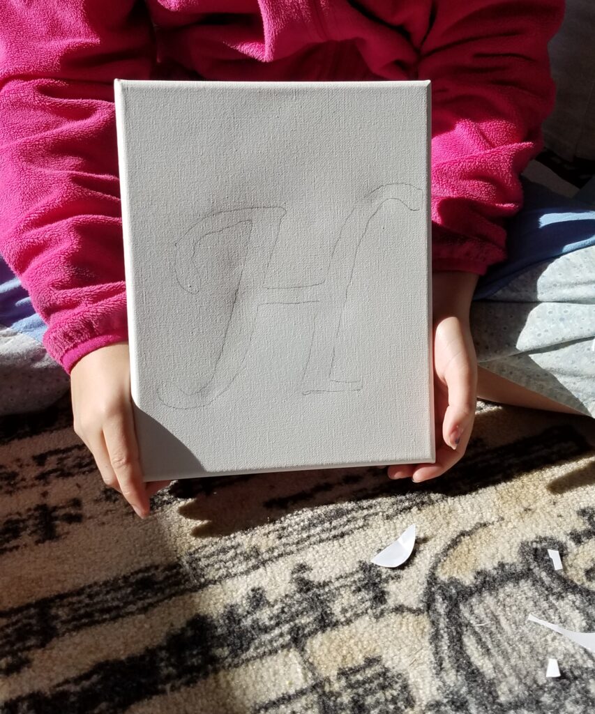 Letter H traced on canvas
