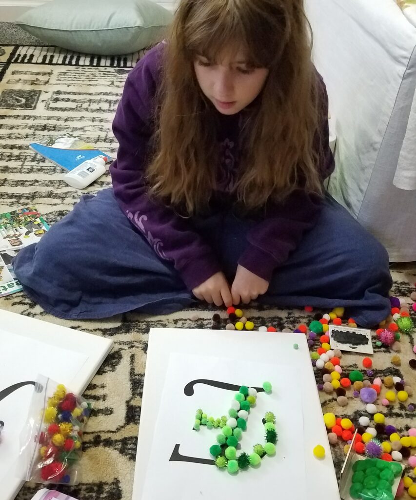 choosing colors for pom pom canvas craft
