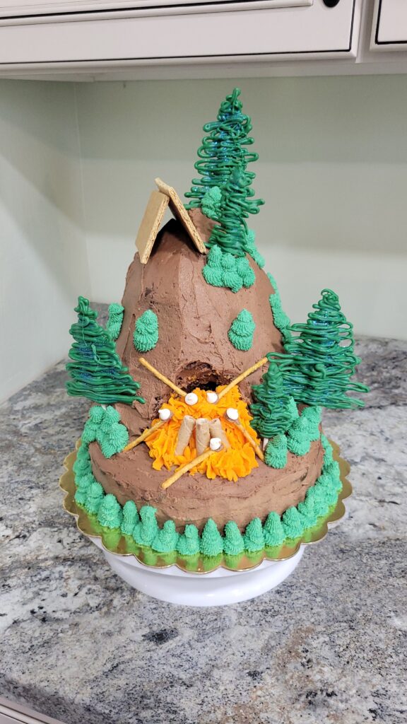 campfire cake with trees and tent