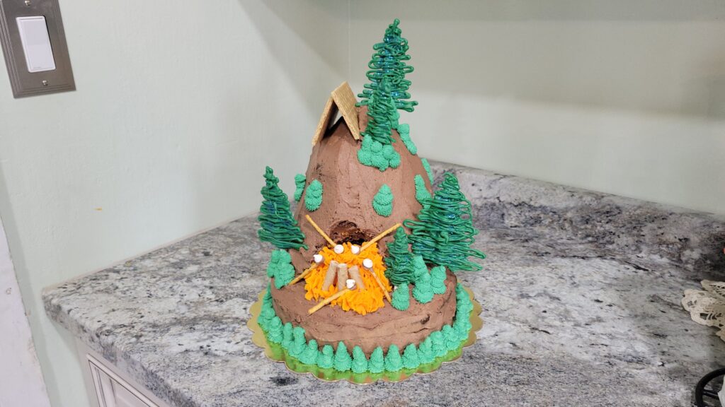 campfire themed chocolate mountain tent cake