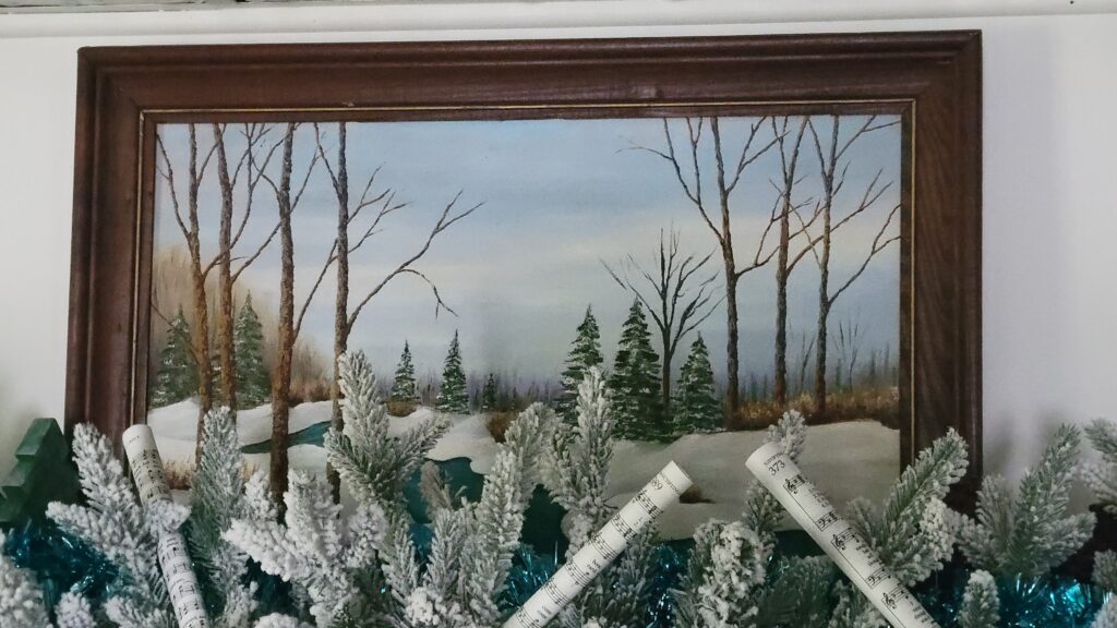 winter painting behind garland