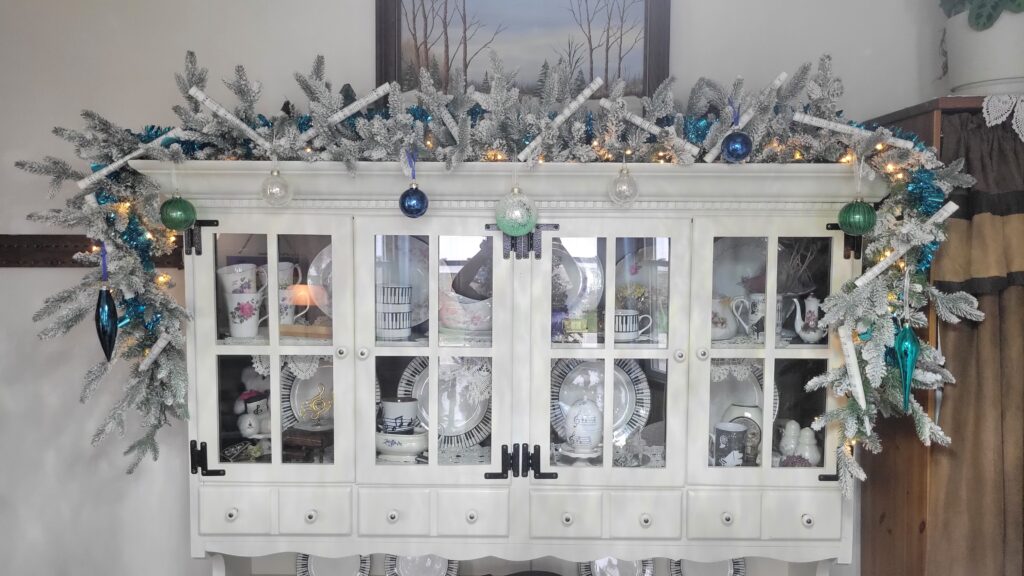 glass ornament on Christmas hutch