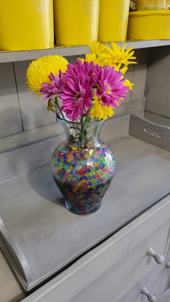 orbeez in a vase with flowers