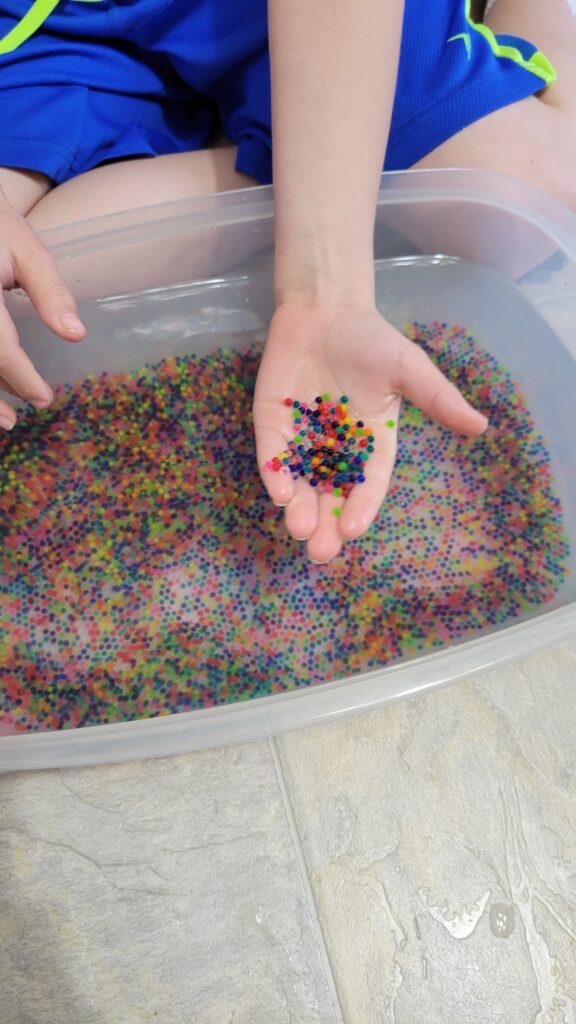 a hand holding orbeez