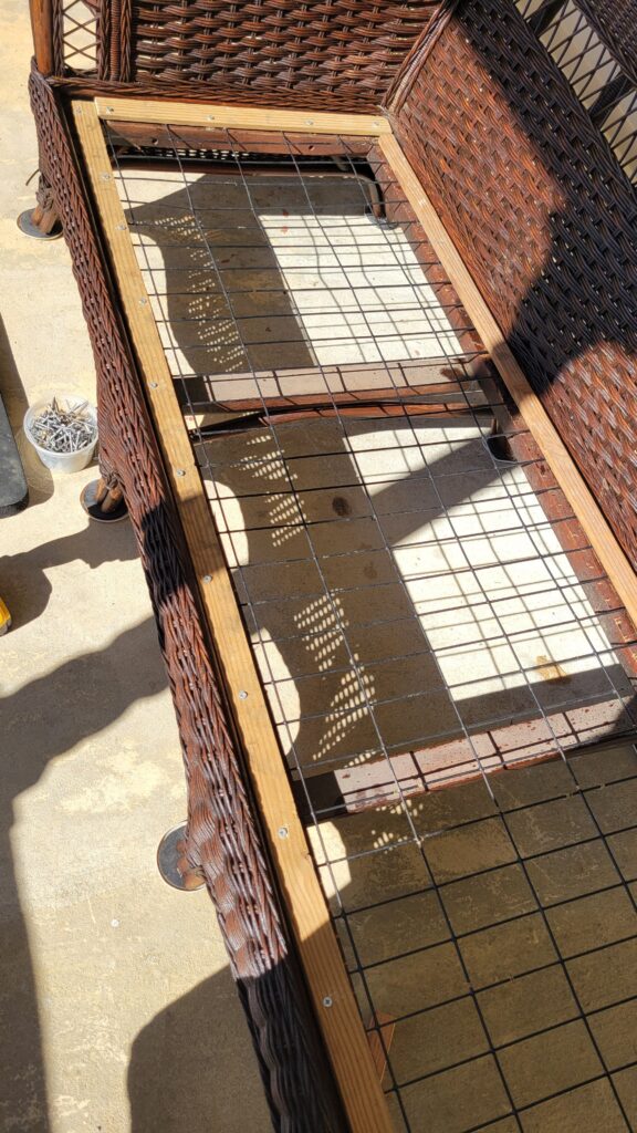 securing wire to the bottom of wicker couch