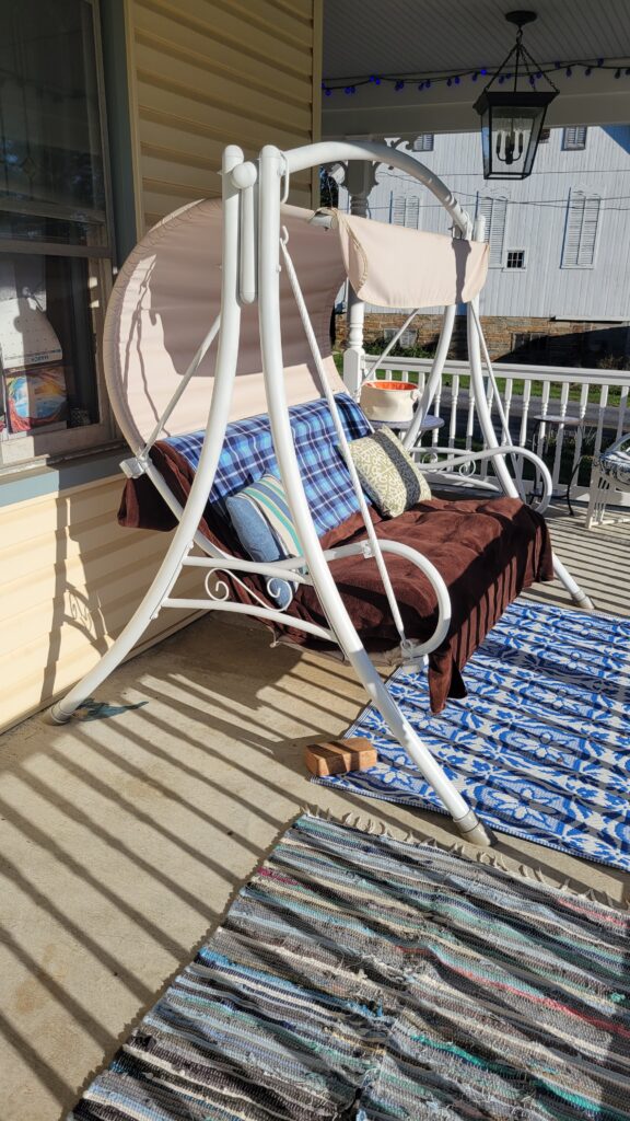Porch swing after white spray paint